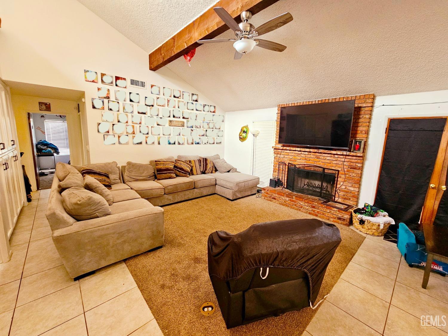 Undisclosed Address Bakersfield, CA 93309 - Photo 12 of 28 a bedroom with furniture and a flat screen tv