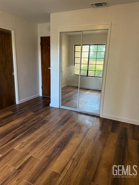 Undisclosed Address Bakersfield, CA 93309 - Photo 15 of 28 an empty room with wooden floor and door