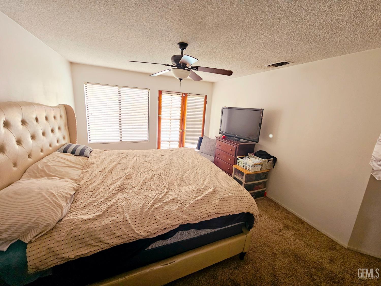 Undisclosed Address Bakersfield, CA 93309 - Photo 16 of 28 a bedroom with a bed and window