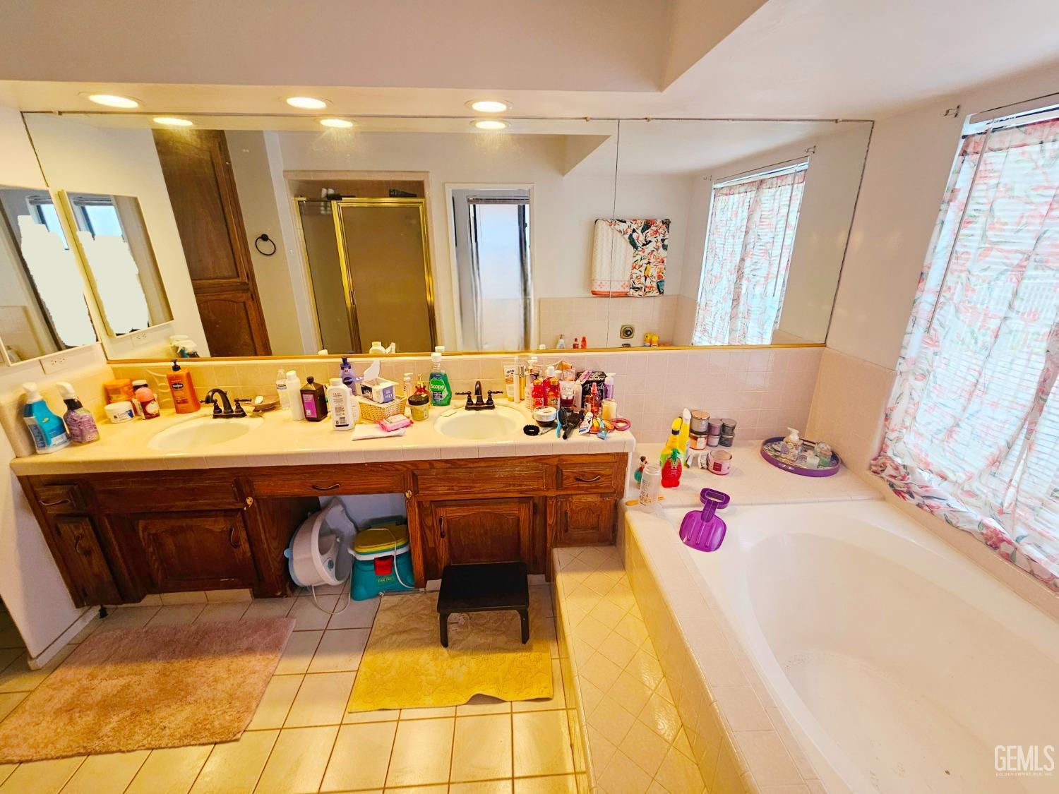 Undisclosed Address Bakersfield, CA 93309 - Photo 21 of 28 a bathroom with a sink and a mirror
