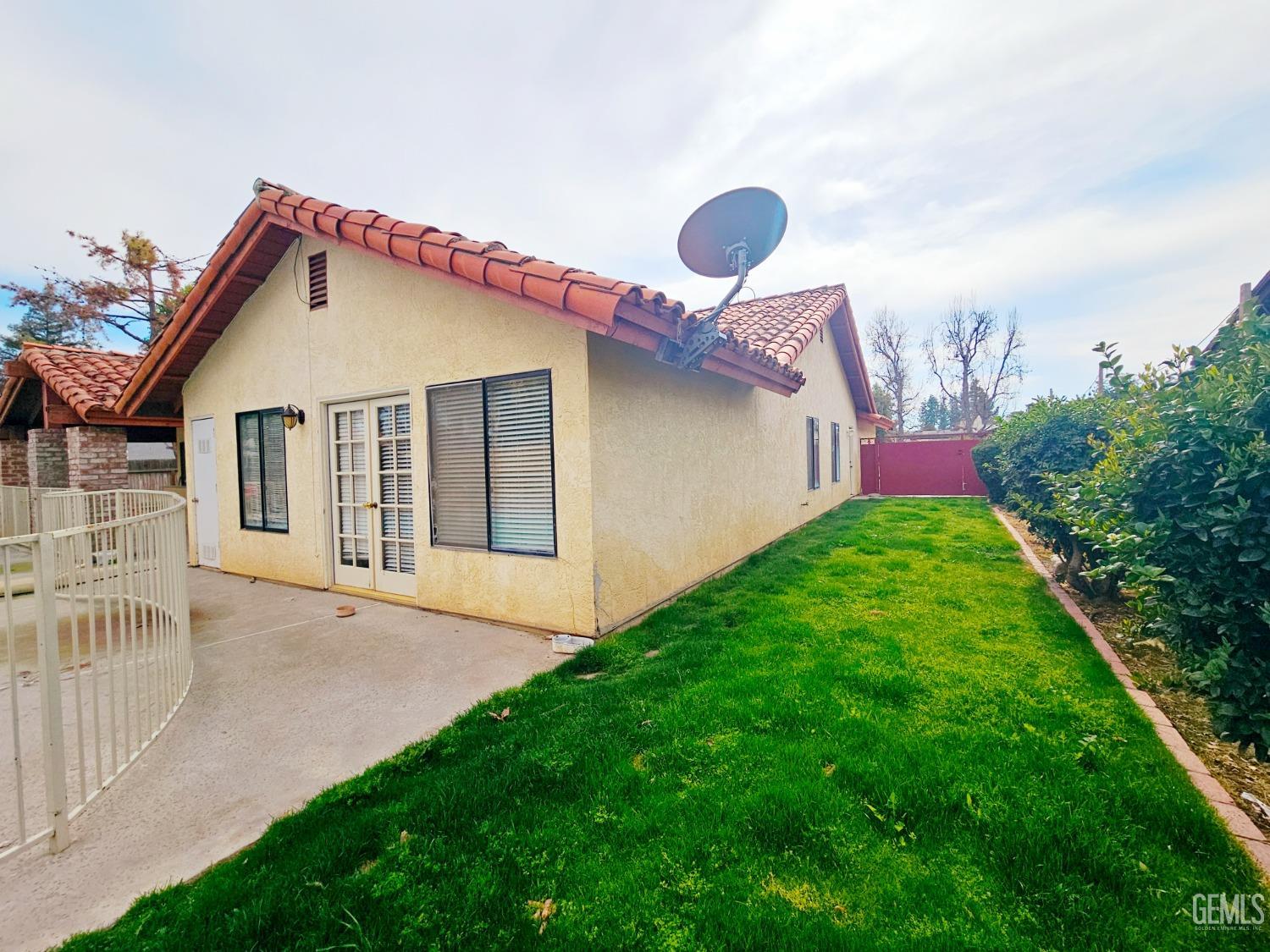 Undisclosed Address Bakersfield, CA 93309 - Photo 23 of 28 a backyard of a house with a garden and barbeque oven