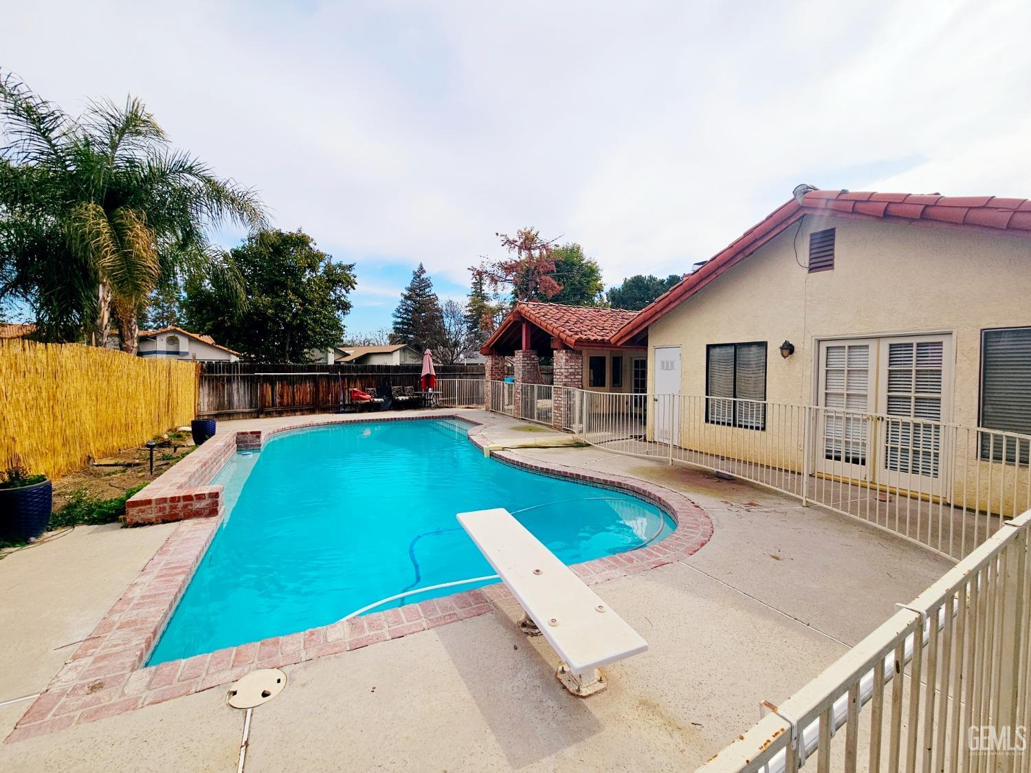 Undisclosed Address Bakersfield, CA 93309 - Photo 24 of 28 a view of a house with swimming pool