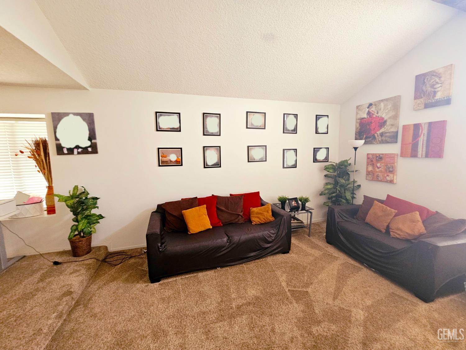 Undisclosed Address Bakersfield, CA 93309 - Photo 5 of 28 a living room with furniture and flowers