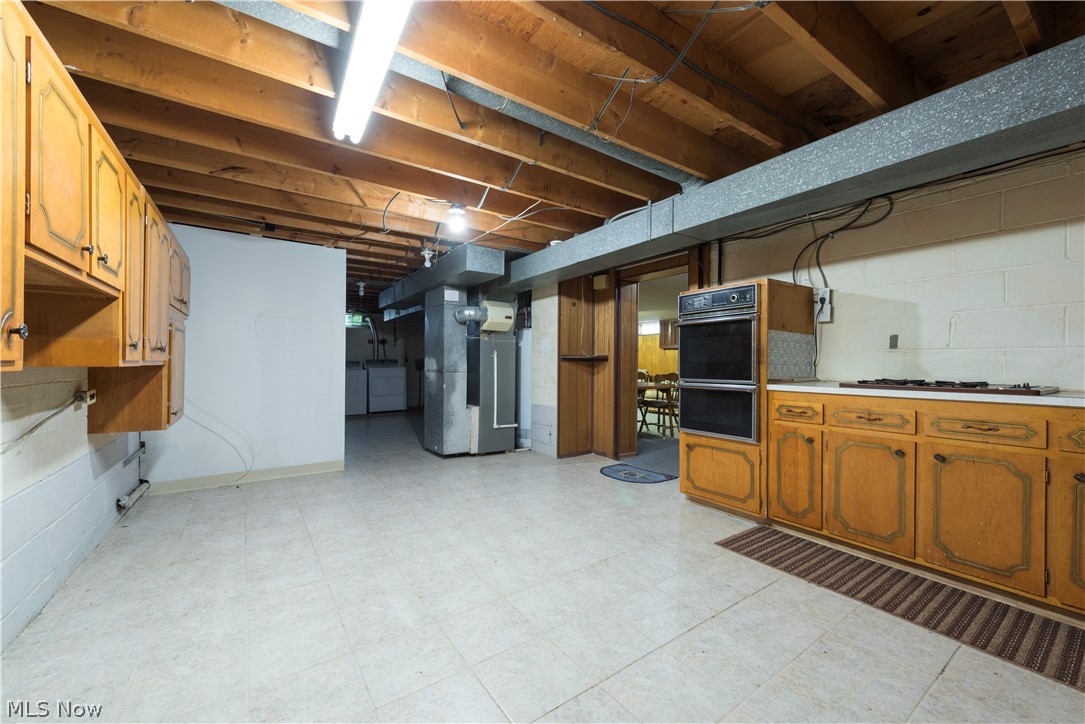 13617 Sheldon Road Cleveland, OH 44130 - Photo 26 of 36 Basement with heating utilities, washer / dryer, and light tile floors