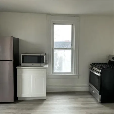 a kitchen with a stove and a microwave