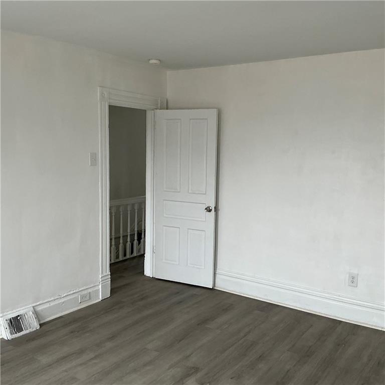 216 Ridge Avenue New Kensington, PA 15068 - Photo 25 of 27 an empty room with wooden floor