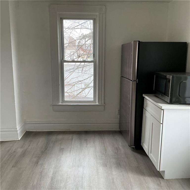 216 Ridge Avenue New Kensington, PA 15068 - Photo 7 of 27 a view of a kitchen with a dishwasher cabinets and a window