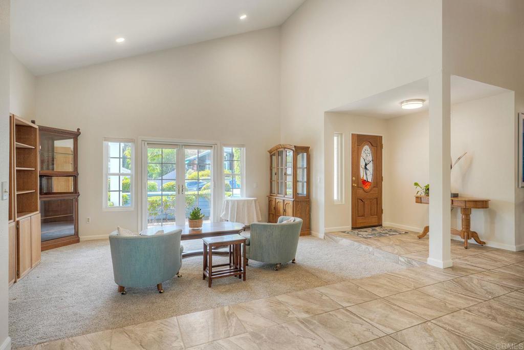 13639 Freeport Road San Diego, CA 92129 - Photo 6 of 44 a living room with furniture and large windows