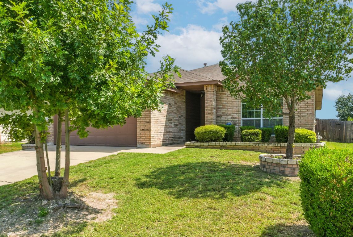 2840 Hearthsong Loop Round Rock, TX 78665 - Photo 2 of 39 a view of a house with backyard and a tree