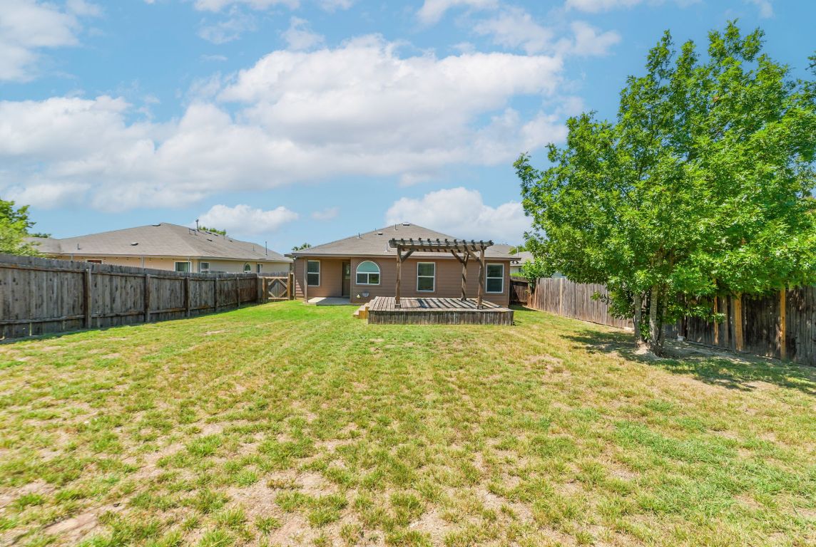 2840 Hearthsong Loop Round Rock, TX 78665 - Photo 36 of 39 a front view of a house with a garden