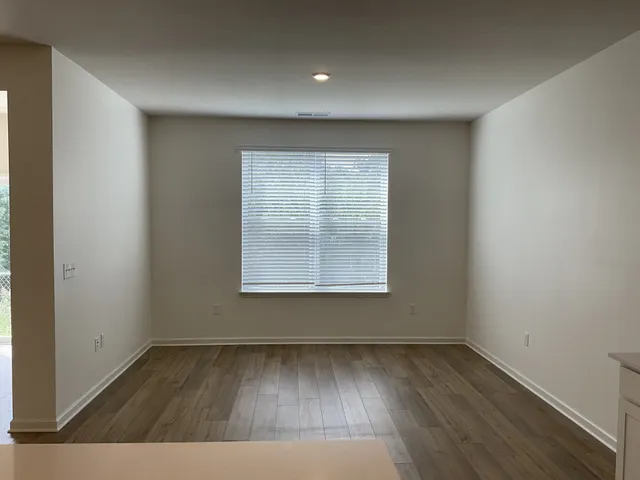 a kitchen with stainless steel appliances a refrigerator and a stove top oven