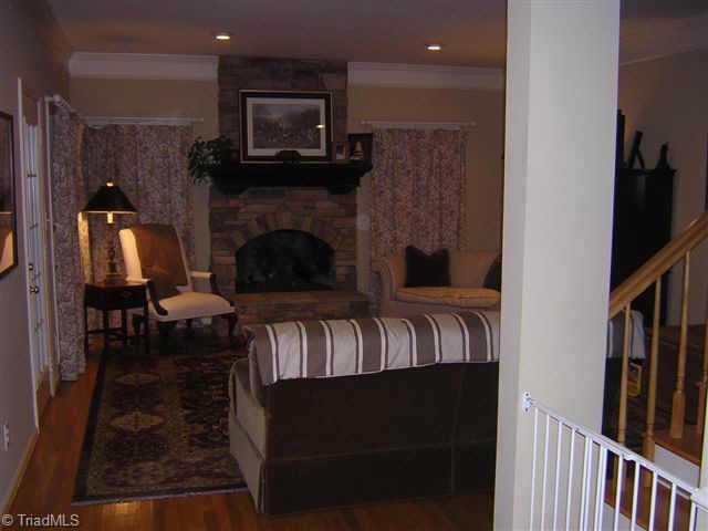 Other. Warm & cozy family room w/beautiful stone fireplace & hardwoods.