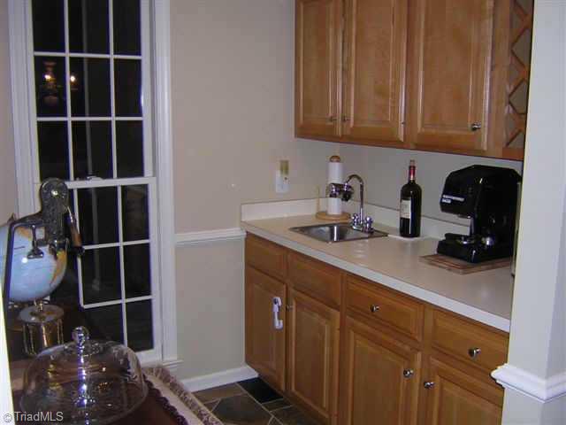 Other. Wet bar w/maple cabinets, wine rack, & slate flooring.