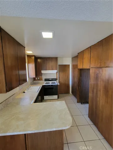 a kitchen with stainless steel appliances a refrigerator and a stove