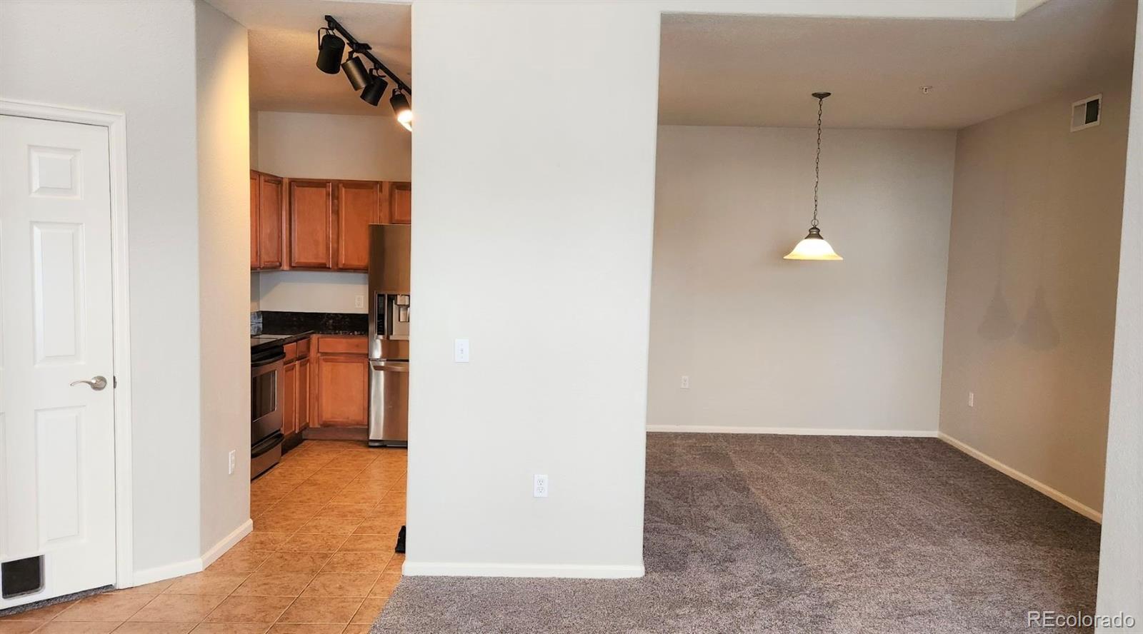 10787 Twenty Mile Road, Unit 305 Parker, CO 80134 - Photo 12 of 28 a view of a room with a wardrobe space