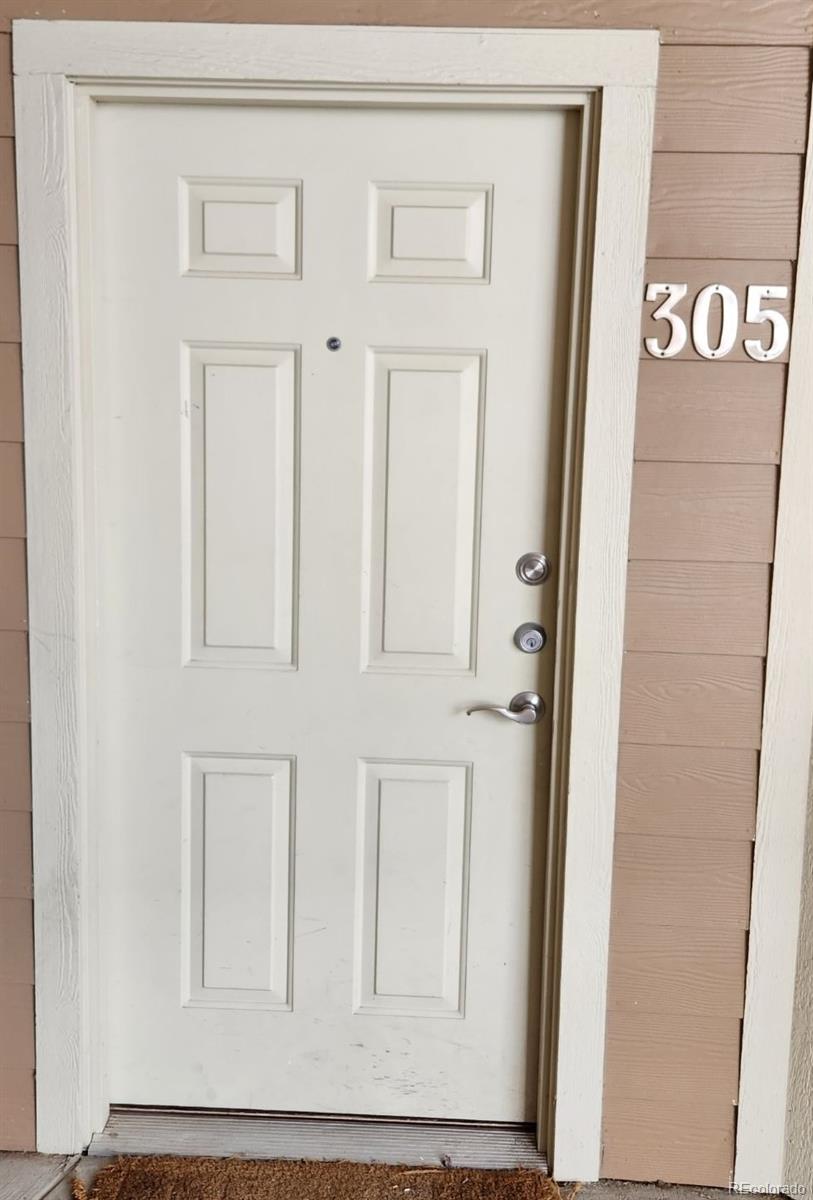 10787 Twenty Mile Road, Unit 305 Parker, CO 80134 - Photo 2 of 28 a view of front door