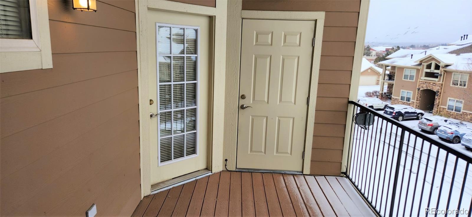 10787 Twenty Mile Road, Unit 305 Parker, CO 80134 - Photo 3 of 28 a view of a balcony from door