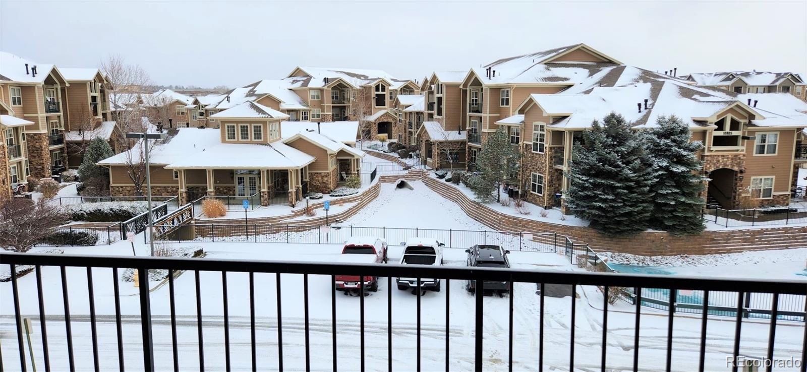 10787 Twenty Mile Road, Unit 305 Parker, CO 80134 - Photo 5 of 28 a view of a houses with city street