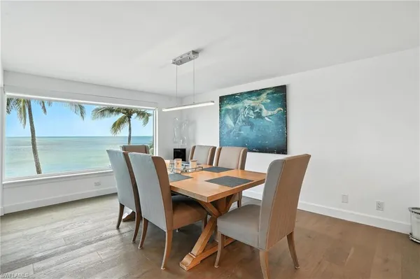 a large kitchen with a large counter top appliances and furniture