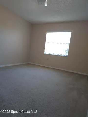an empty room with closet area
