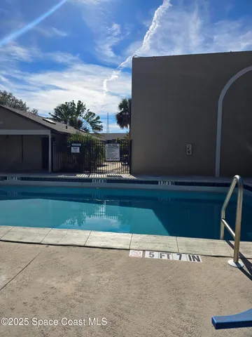 a view of a balcony with furniture