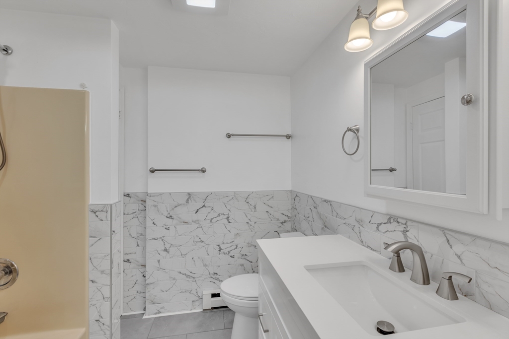 14 Union Road Holland, MA 01521 - Photo 14 of 40 a bathroom with a sink and a toilet