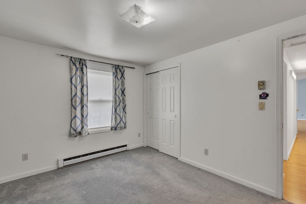14 Union Road Holland, MA 01521 - Photo 19 of 40 an empty room with windows and closet