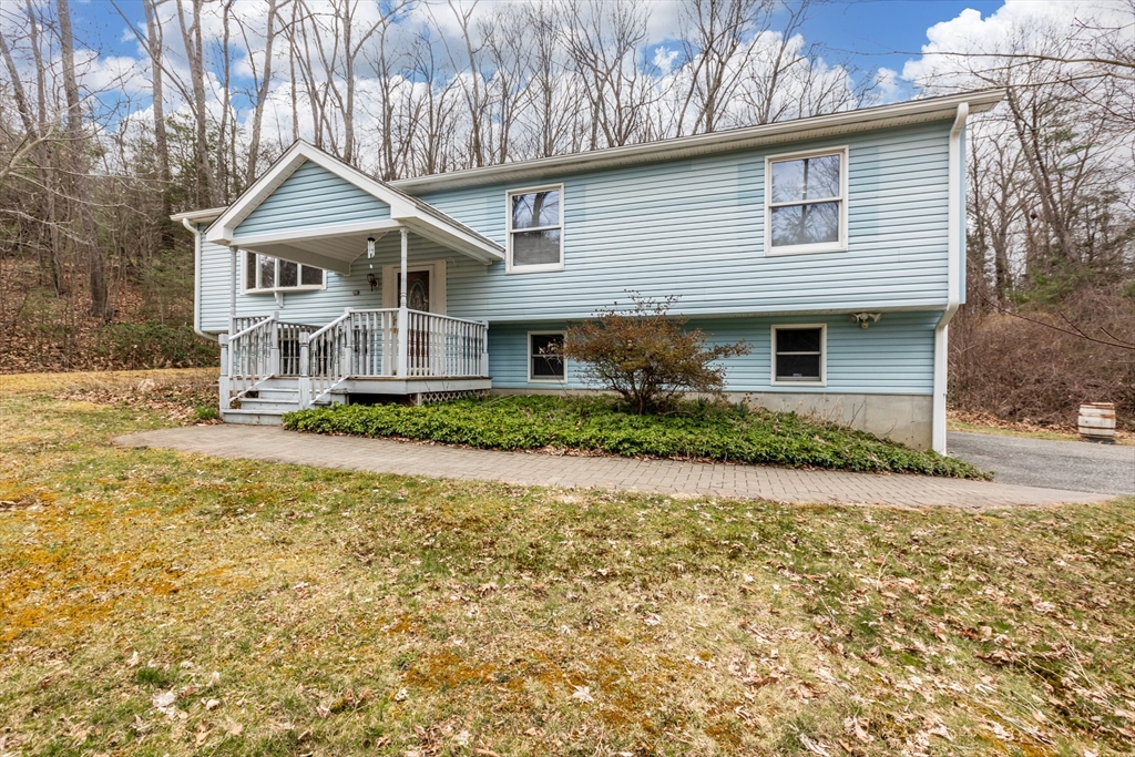 14 Union Road Holland, MA 01521 - Photo 29 of 40 a front view of a house with a yard