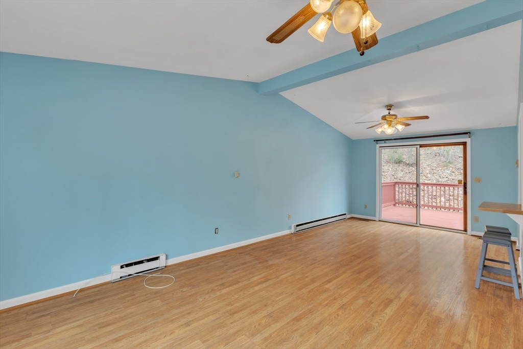 14 Union Road Holland, MA 01521 - Photo 4 of 40 wooden floor in an empty room with a window