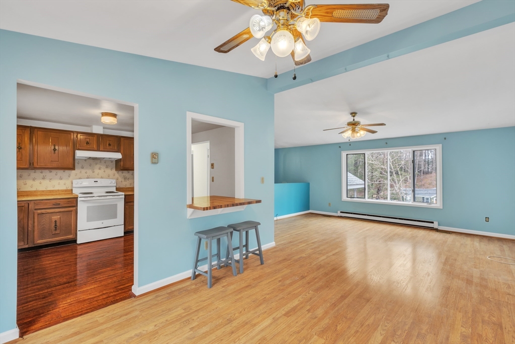 14 Union Road Holland, MA 01521 - Photo 8 of 40 a view an empty room and kitchen with wooden floor