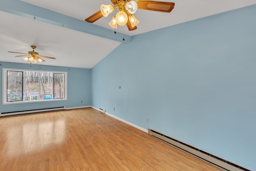 14 Union Road Holland, MA 01521 - Photo 9 of 40 a view of an empty room with window and wooden floor