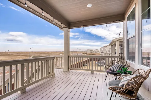 a view of a balcony with wooden floor