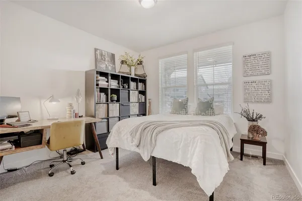 a bed room with furniture and a window