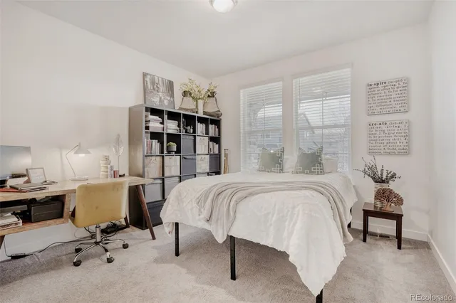 a bed room with furniture and a window