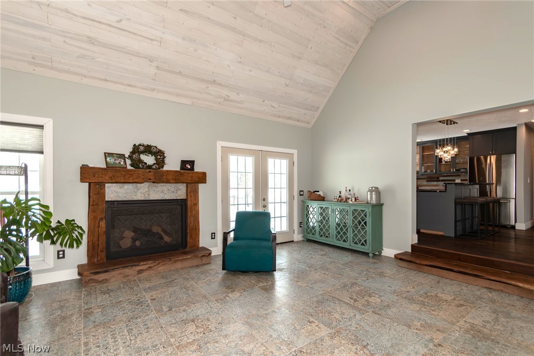 18919 Ravenna Road Chagrin Falls, OH 44023 - Photo 12 of 48 The gas fireplace with rustic wood beam surround will keep you cozy all winter.