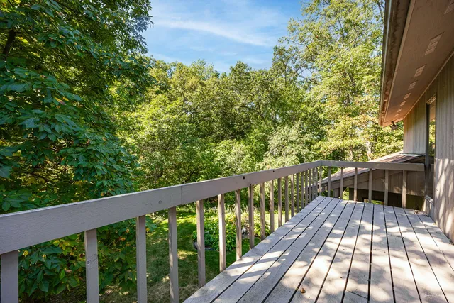a view of balcony with wooden floor