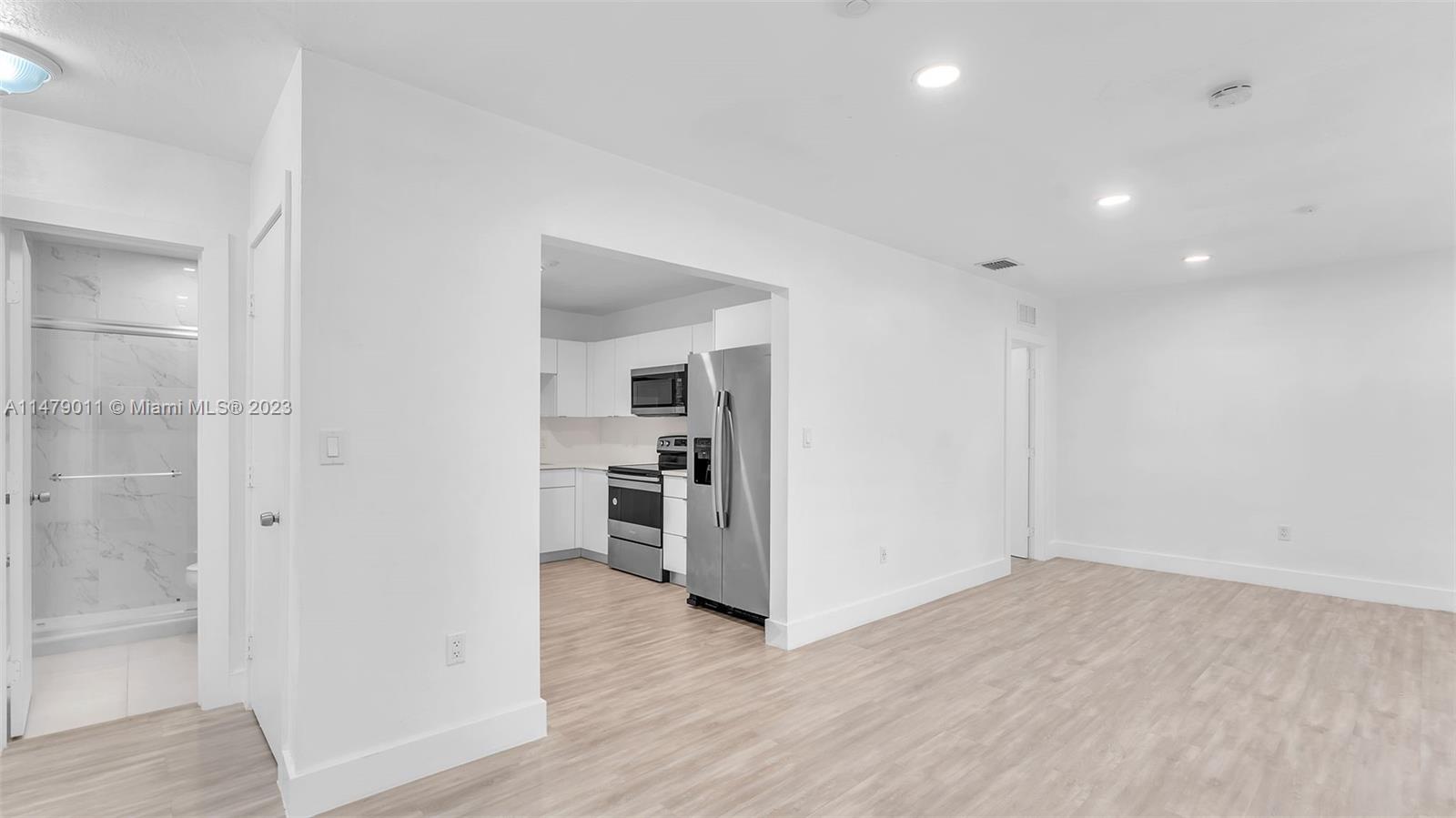 West Flagler Miami, FL 33125 - Photo 22 of 37 a view of a kitchen with a sink and a refrigerator