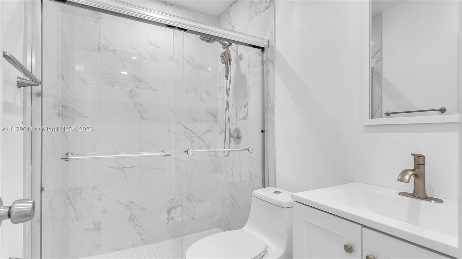 West Flagler Miami, FL 33125 - Photo 26 of 37 a bathroom with a sink toilet and shower