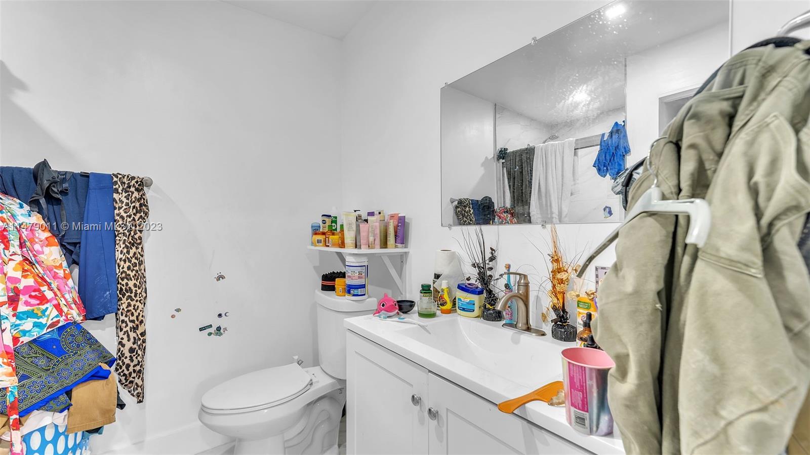 West Flagler Miami, FL 33125 - Photo 35 of 37 a white bath tub sitting next to a white bath tub sitting next to a small bathroom