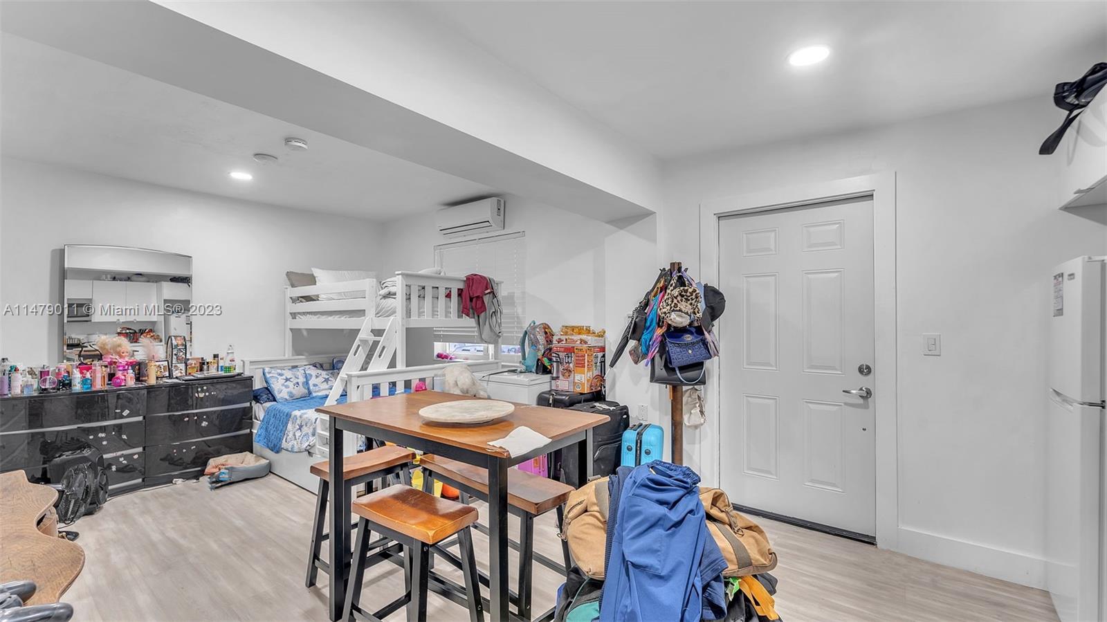 West Flagler Miami, FL 33125 - Photo 36 of 37 a view of a dining room with furniture and wooden floor