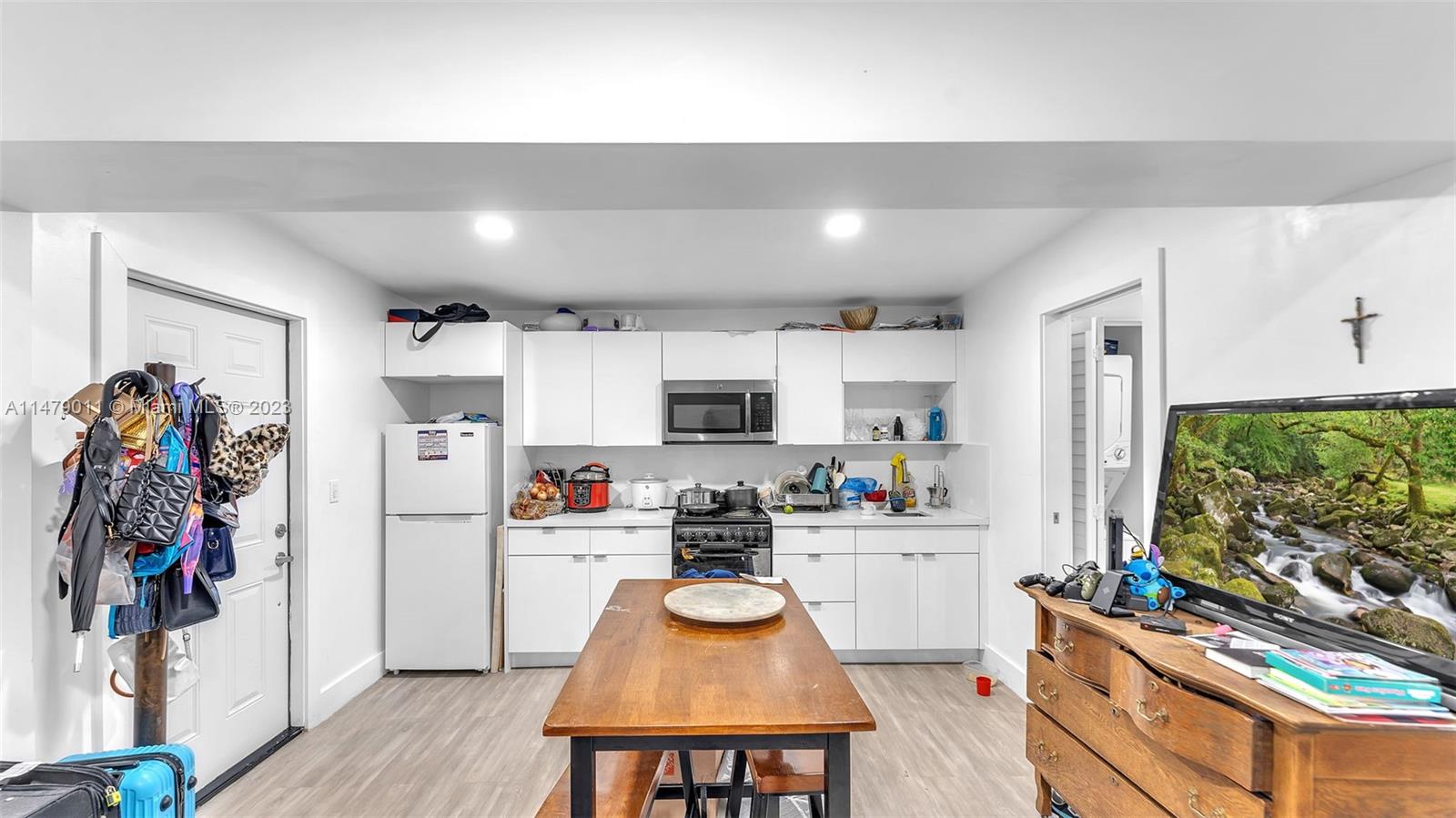 West Flagler Miami, FL 33125 - Photo 37 of 37 a kitchen with stainless steel appliances a stove a sink and a refrigerator