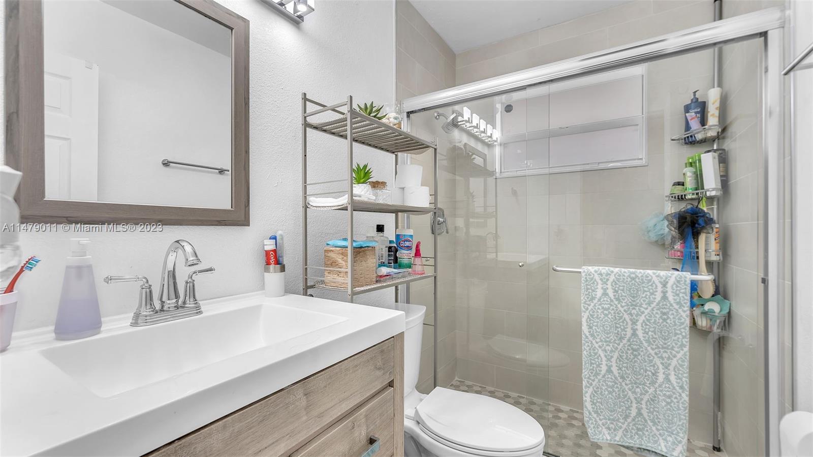 West Flagler Miami, FL 33125 - Photo 6 of 37 a bathroom with a sink toilet and shower