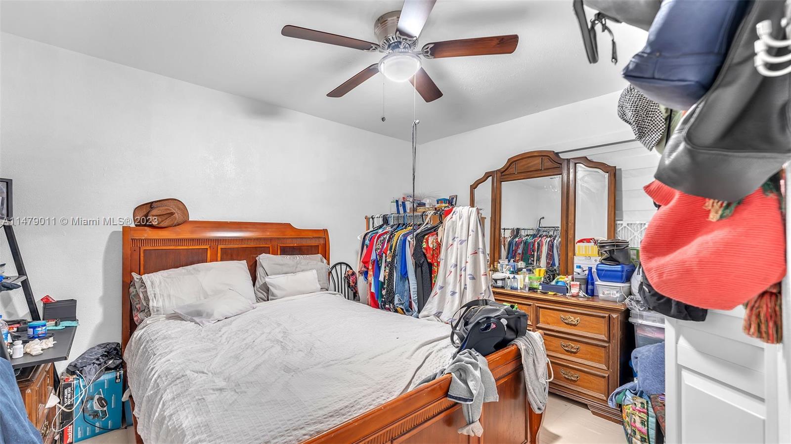 West Flagler Miami, FL 33125 - Photo 8 of 37 a bedroom with a bed and dresser