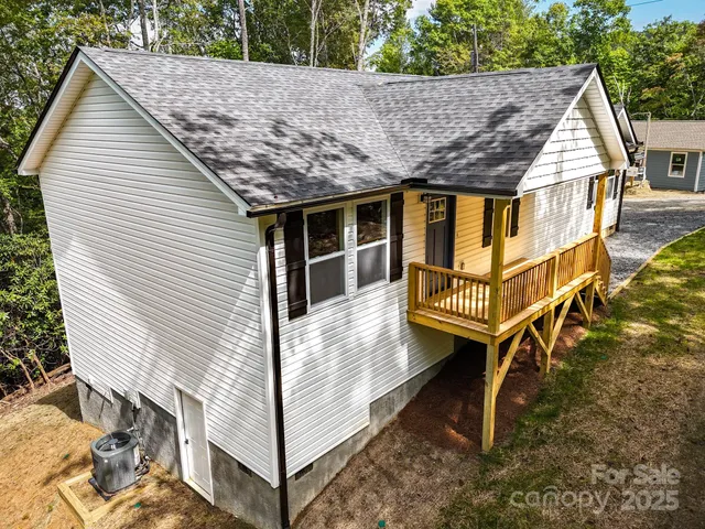 a view of a white house with large windows