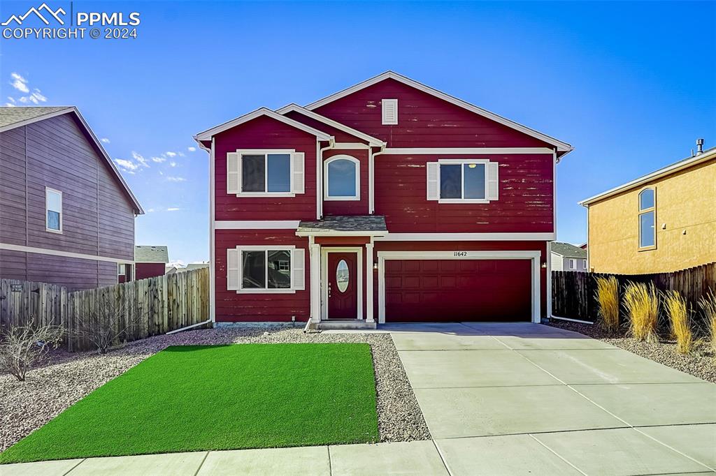 a front view of a house with yard