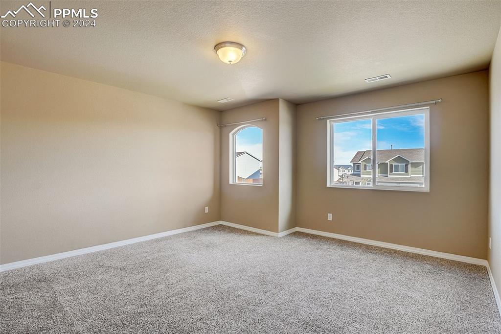 11642 Avena Road Peyton, CO 80831 - Photo 20 of 50 an empty room with windows and closet