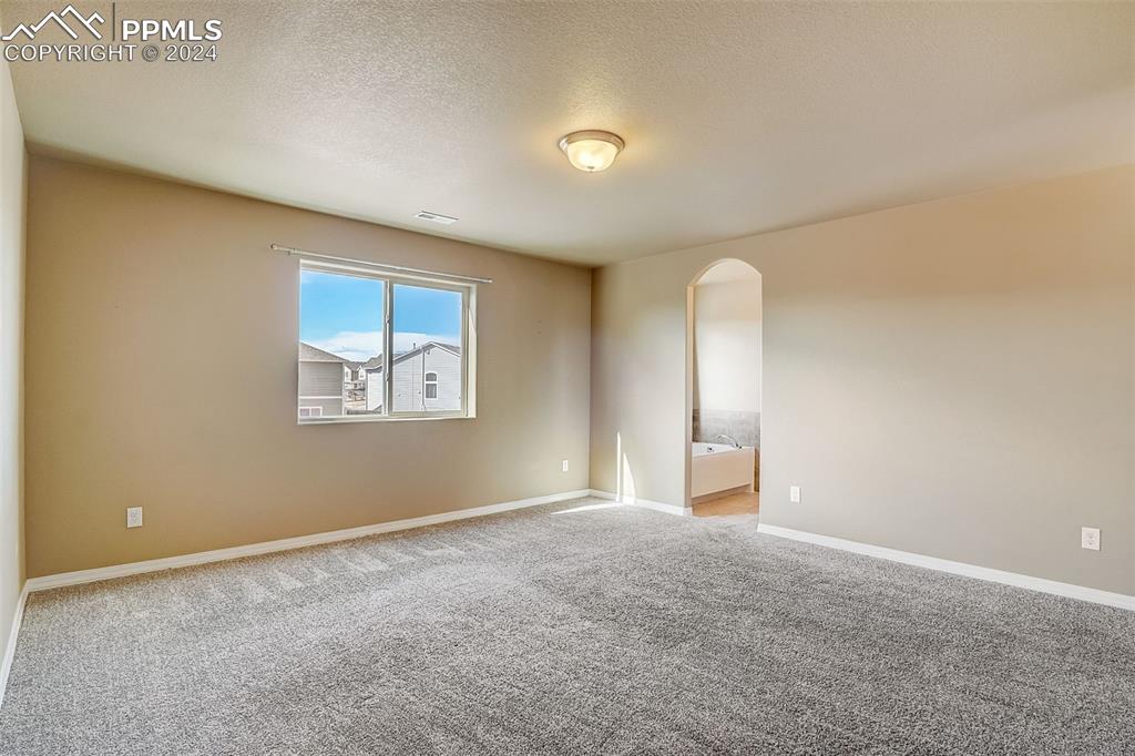 11642 Avena Road Peyton, CO 80831 - Photo 23 of 50 an empty room with windows and closet