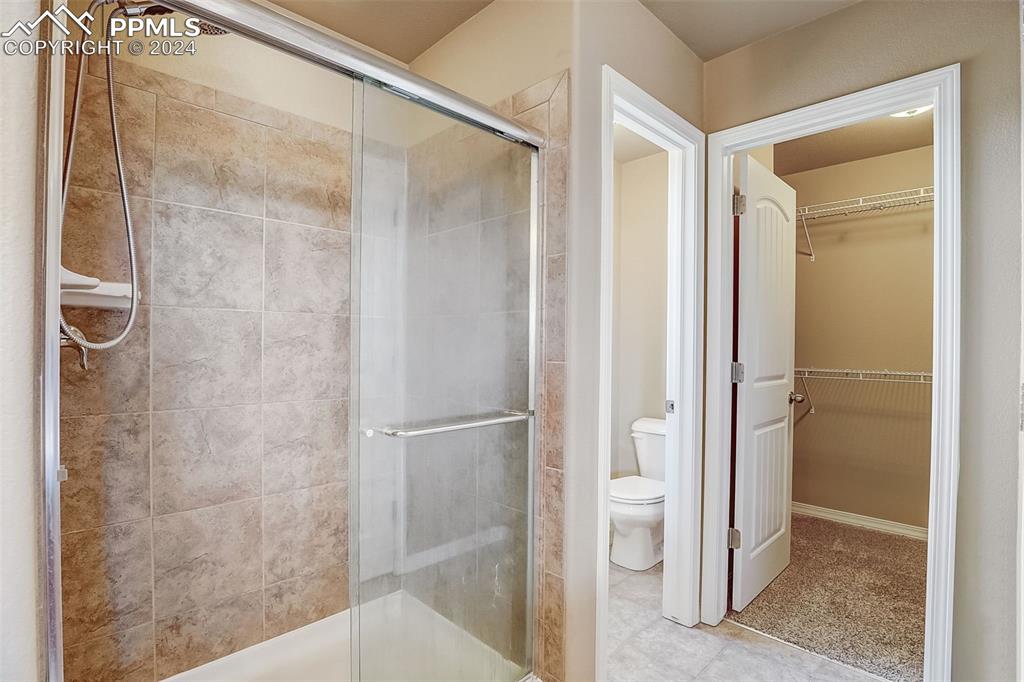 11642 Avena Road Peyton, CO 80831 - Photo 27 of 50 a bathroom with a shower and toilet