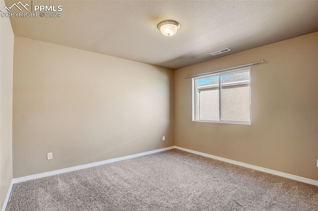 11642 Avena Road Peyton, CO 80831 - Photo 32 of 50 an empty room with a empty space and windows
