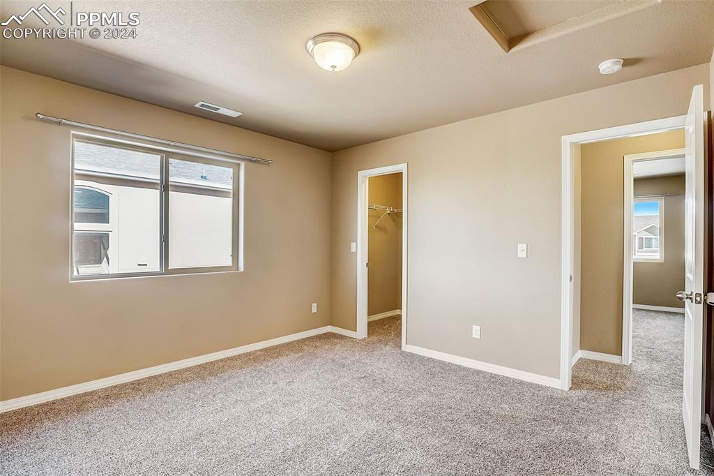 11642 Avena Road Peyton, CO 80831 - Photo 33 of 50 an empty room with windows and closet